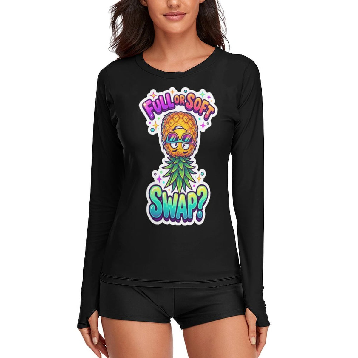 A woman wearing a black long-sleeve graphic t-shirt with a colorful pineapple wearing sunglasses and the text 'FULL OF SOFT SWAP?' on the front, paired with black athletic shorts against a plain white background.