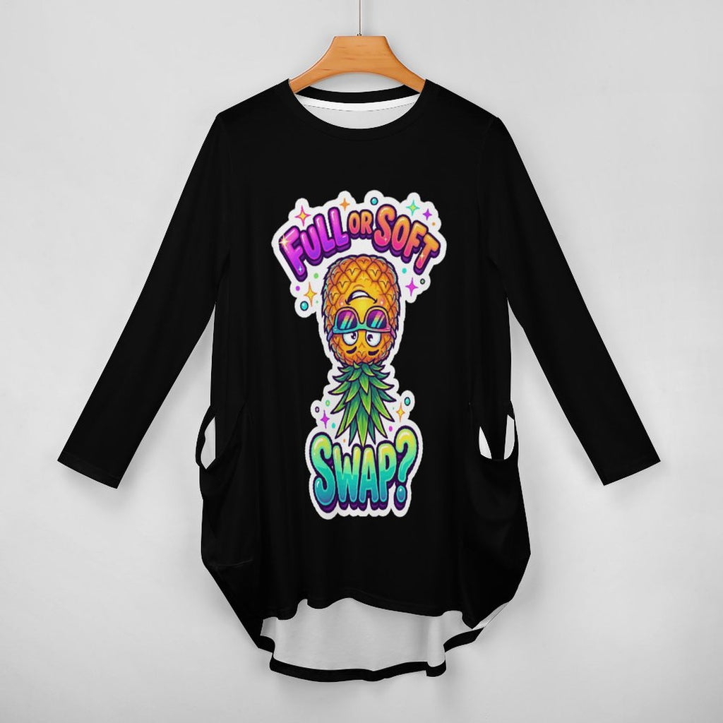 A black long-sleeve tunic top with a colorful pineapple graphic and the text 'FULL FLAVOR SWAP?' hanging on a wooden hanger against a light gray background.