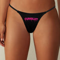 Thong with the words "Cumslut" on them in pink lettering.
