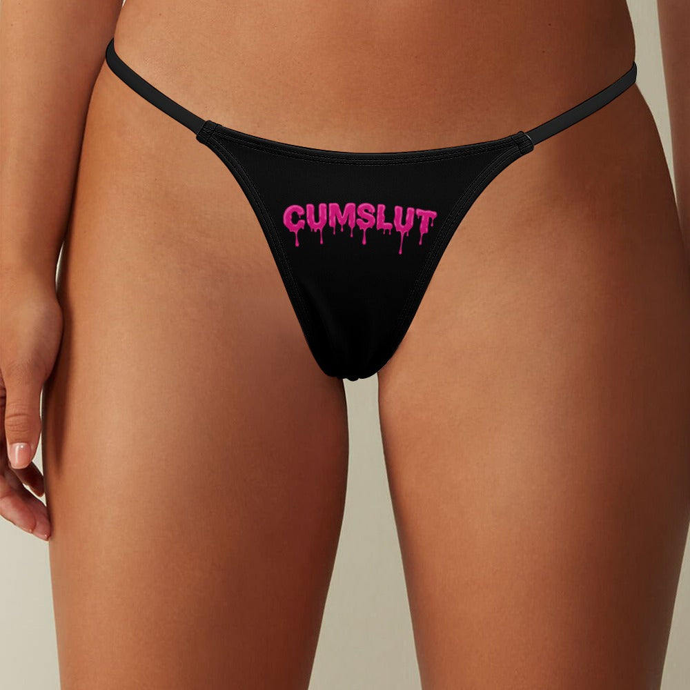 Thong with the words "Cumslut" on them in pink lettering.