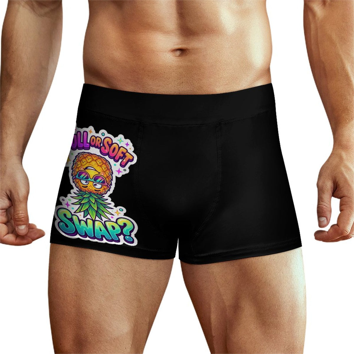 Black men's boxer briefs worn by a model, featuring a colorful graphic print of a pineapple wearing sunglasses and a green leaf crown with the text 'ALL IS SOFT SWAP?'.