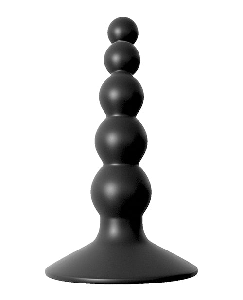 Black decorative object with stacked cylindrical shapes on a white background