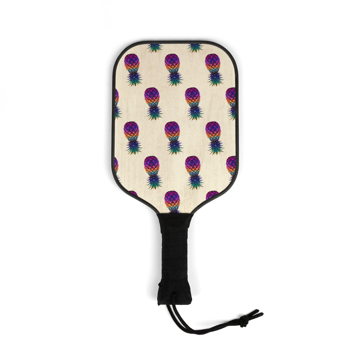 Wooden pickleball paddles featuring vibrant pineapple-inspired artwork printed on both sides.