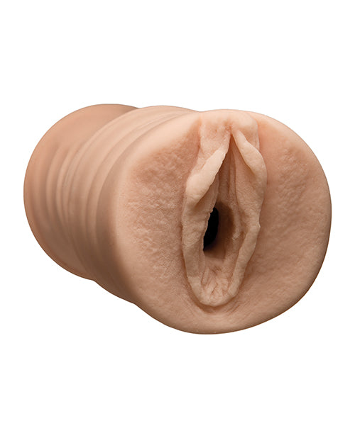 Realistic silicone model of a female reproductive organ on a white background