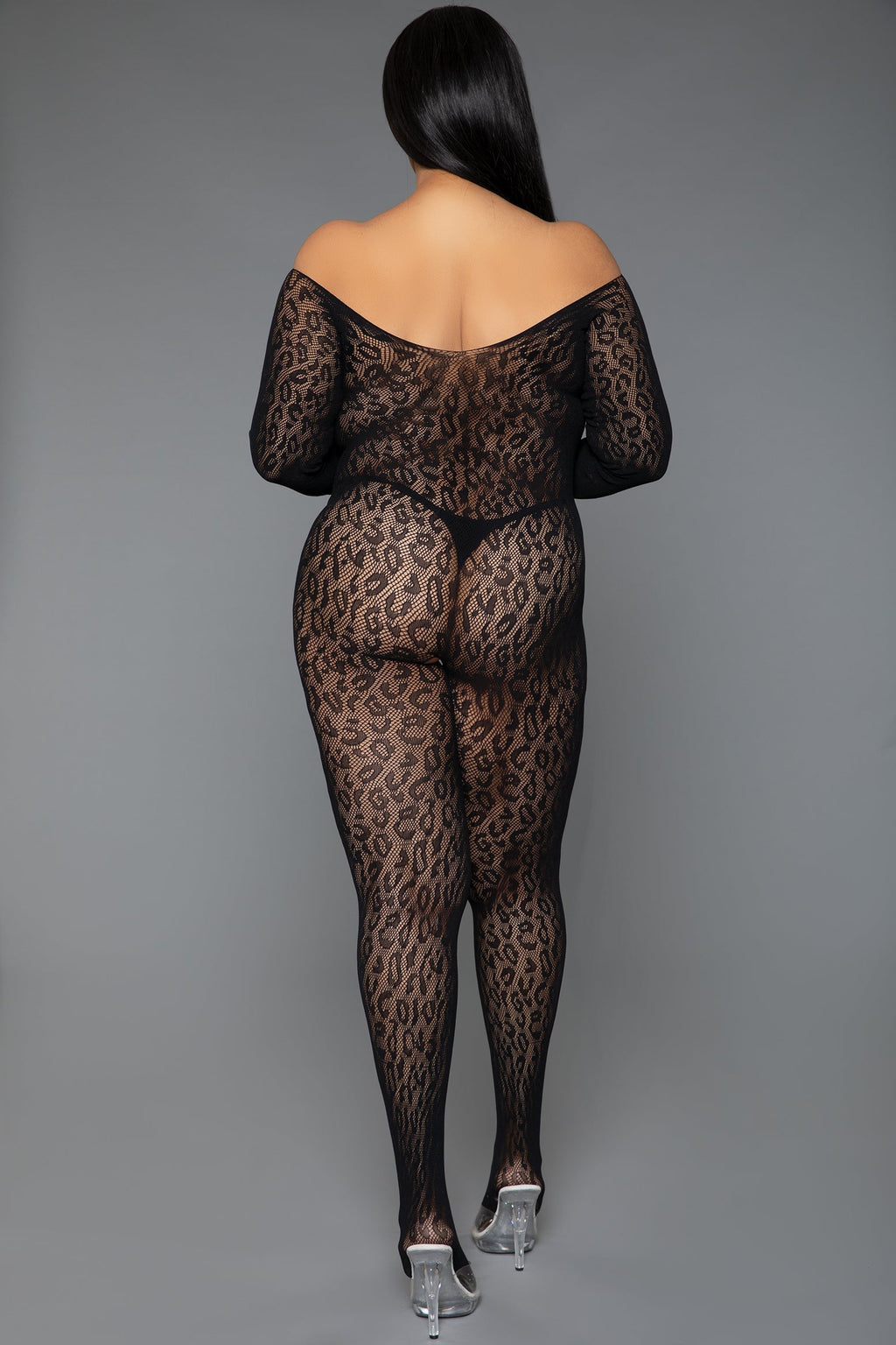 Person wearing a black leopard print bodysuit on a gray background