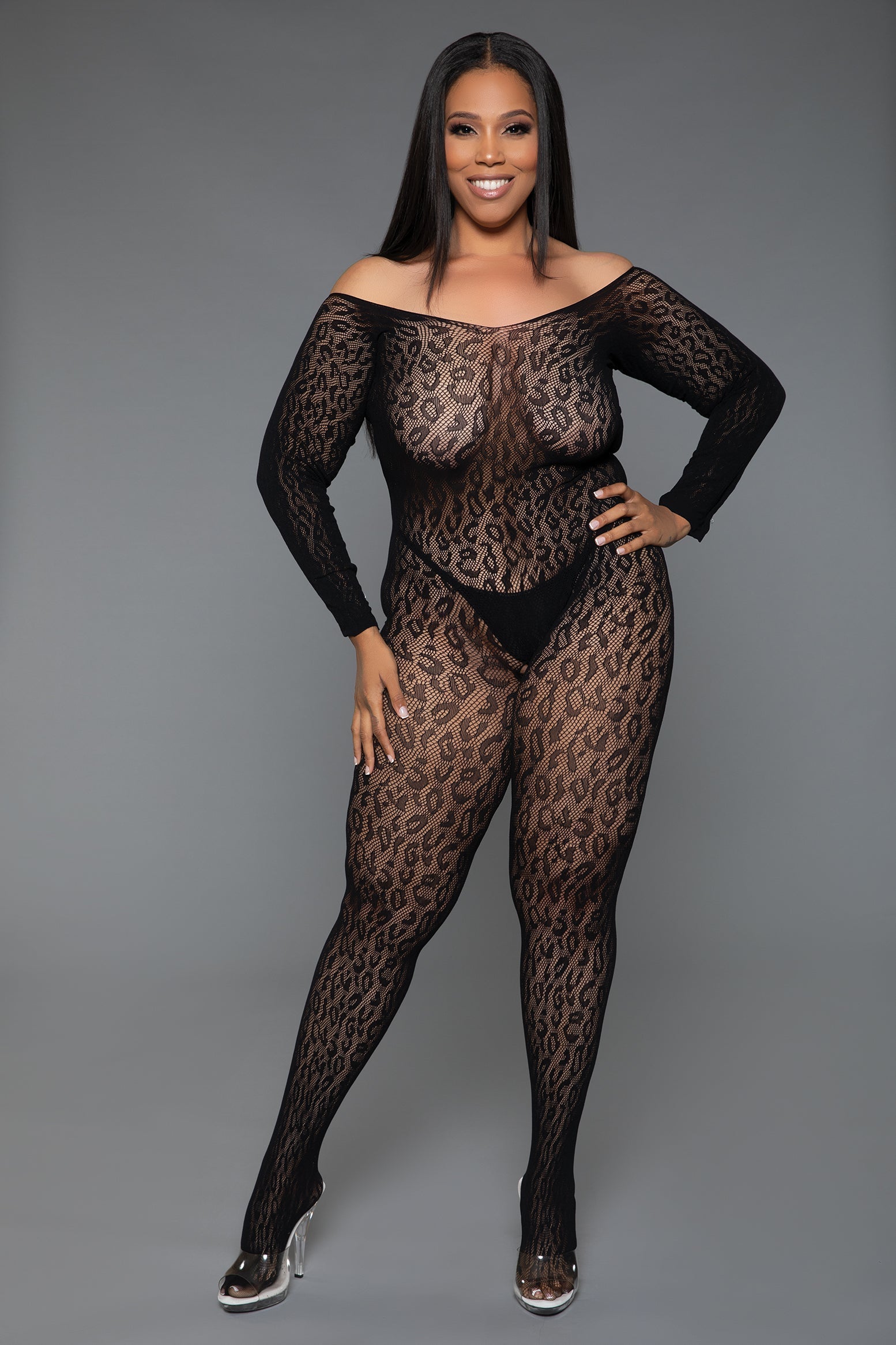 Model wearing a black leopard print bodysuit against a gray background
