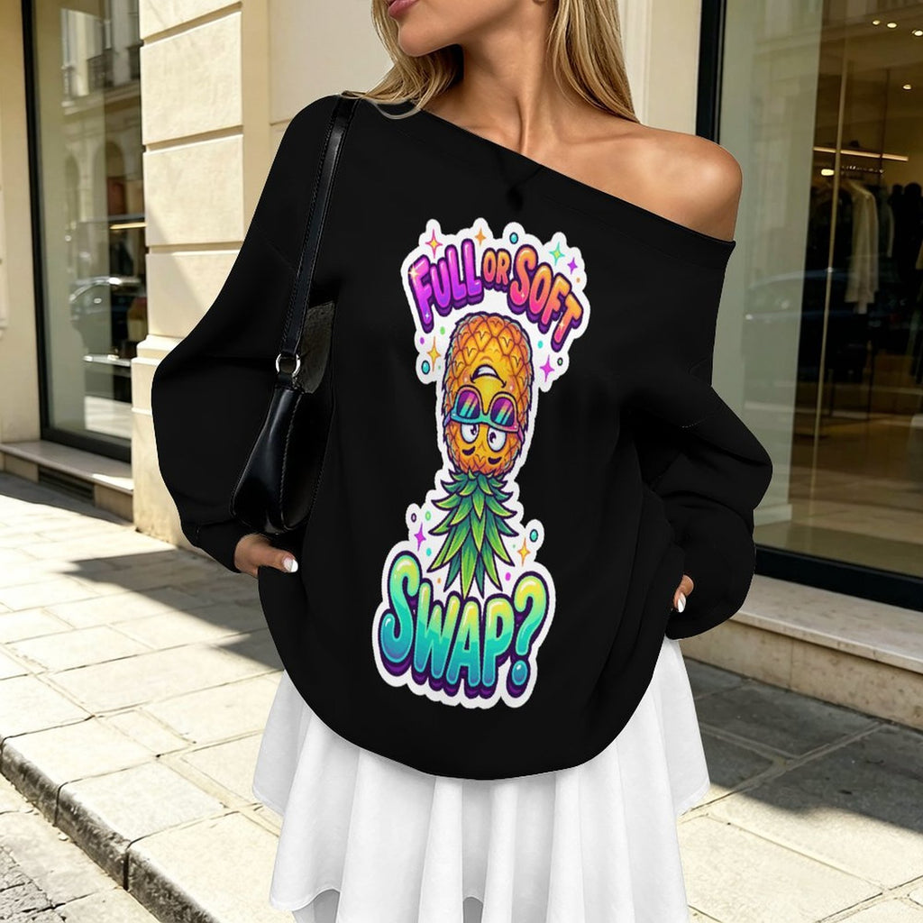 A woman wearing a black off-the-shoulder sweatshirt with a colorful pineapple graphic and the text 'FULL OR SOFT SWAP?' in a real outdoor storefront setting.