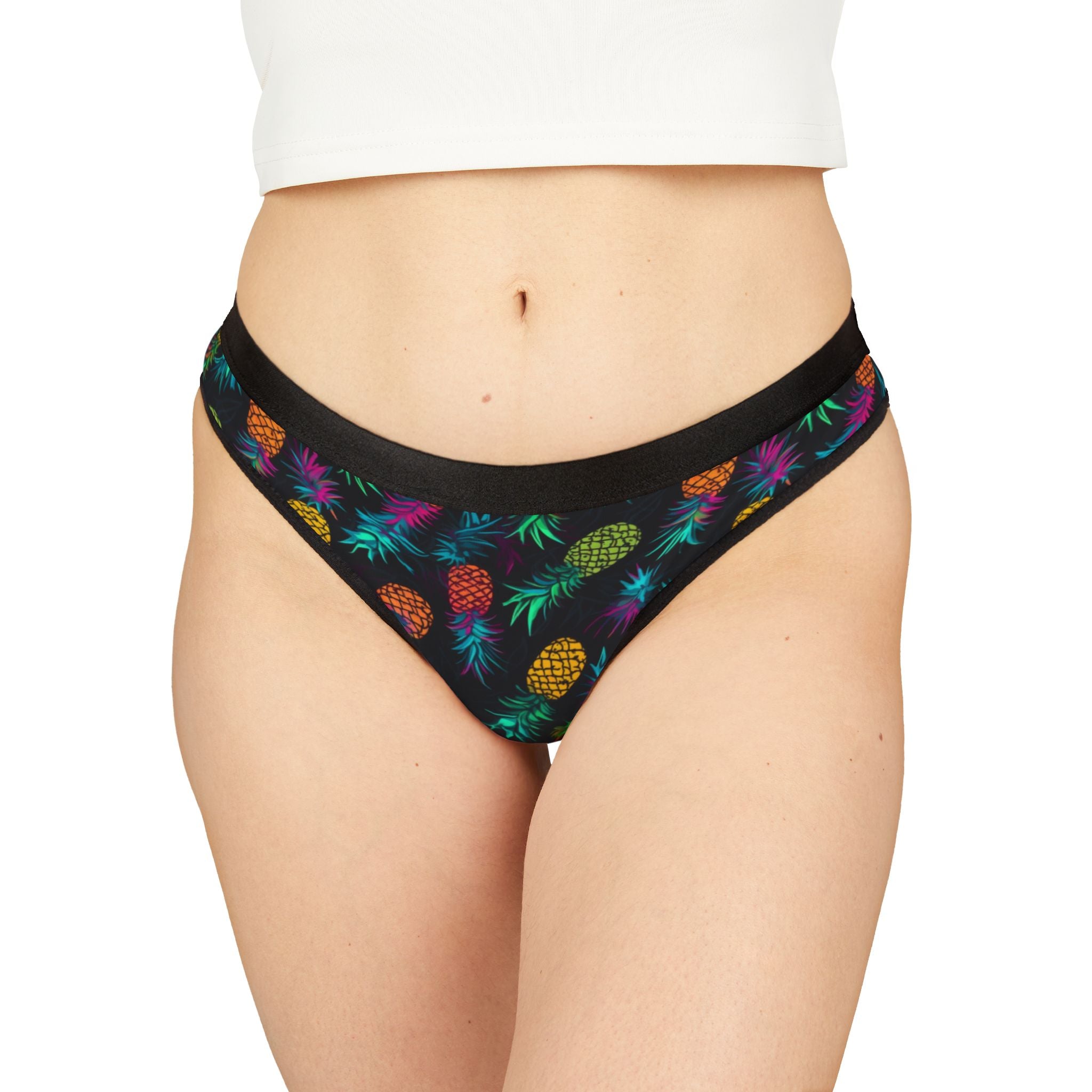 Black underwear with colorful pineapple pattern on a white background. Great for swinger lifestyle gatherings.