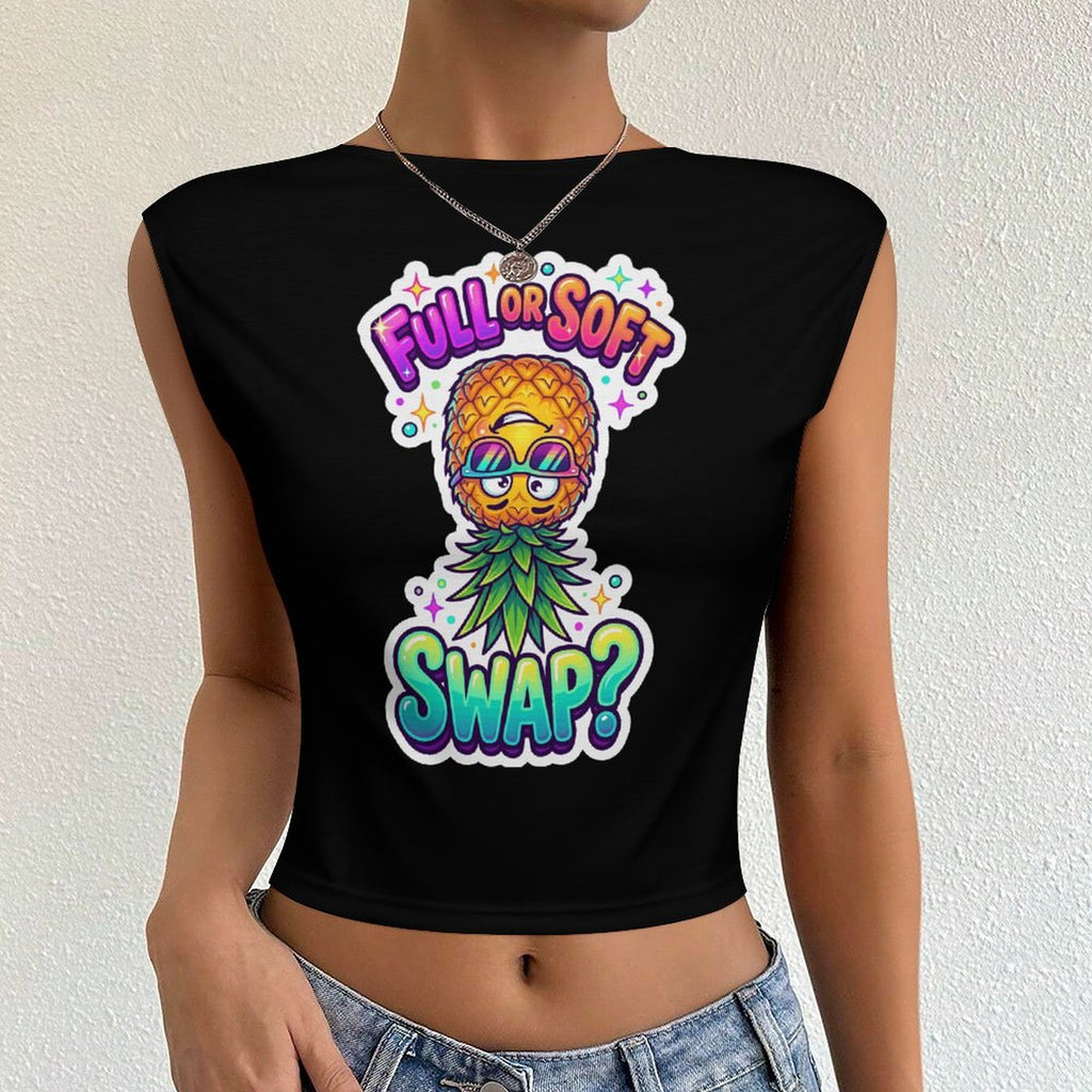 A woman wearing a black crop top with a colorful pineapple graphic and the text 'FULL OR SOFT SWAP?' on the front, paired with light blue denim jeans against a textured off-white wall.