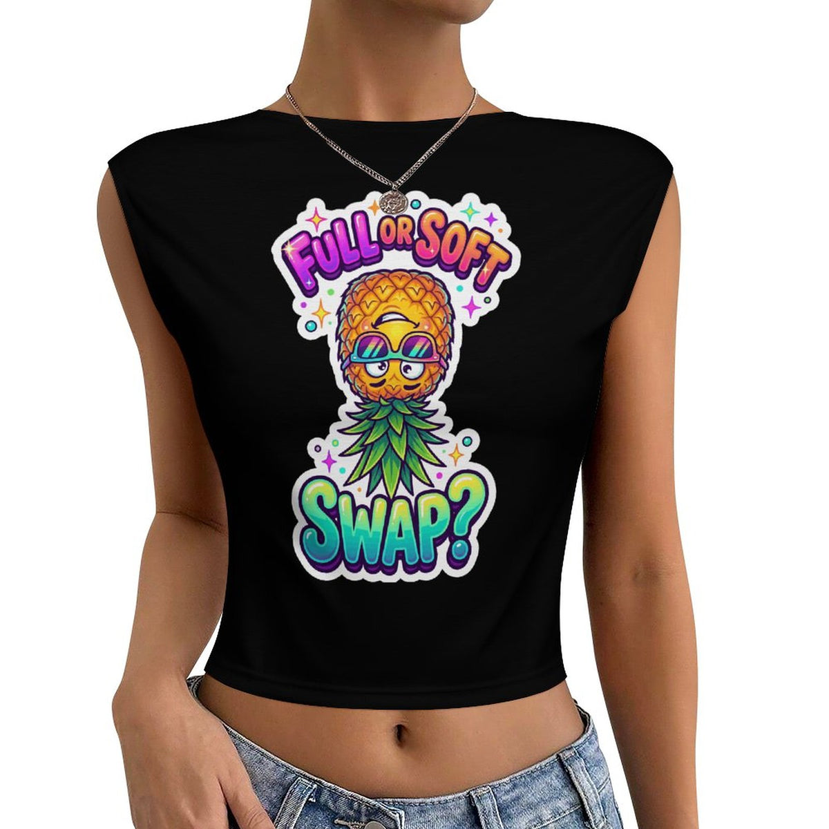 A woman wearing a black cropped sleeveless top with a colorful pineapple graphic and the text 'FULL OR SOFT SWAP?' on the front, paired with light blue denim jeans against a plain white background.