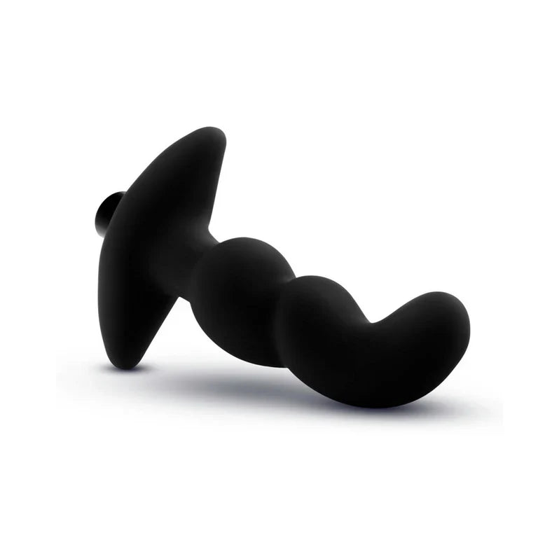 Black silicone butt plug on a white background