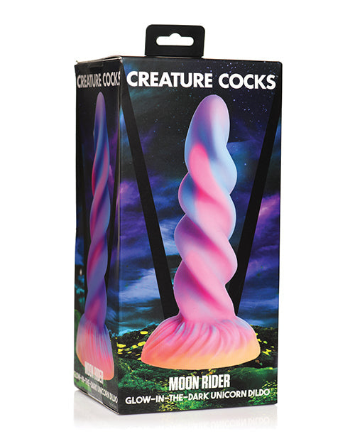 Glow-in-the-dark unicorn dilator packaging with 'Creature Cocks' branding.
