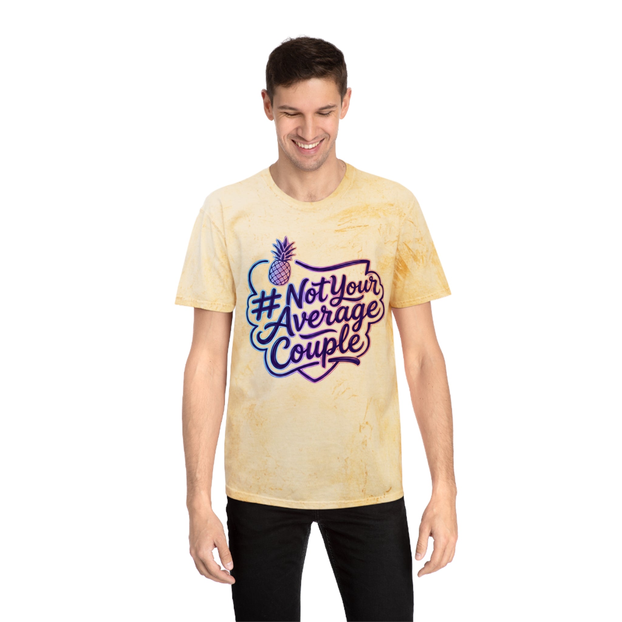 A man wearing a colorful yellow tied t-shirt with #NotYourAverageCouple with a pair of black jeans on.