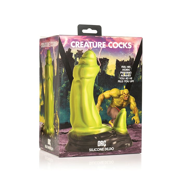 Silicone dildo packaging with creature design on a white background