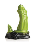 Green ceramic sculpture on a black base against a white background
