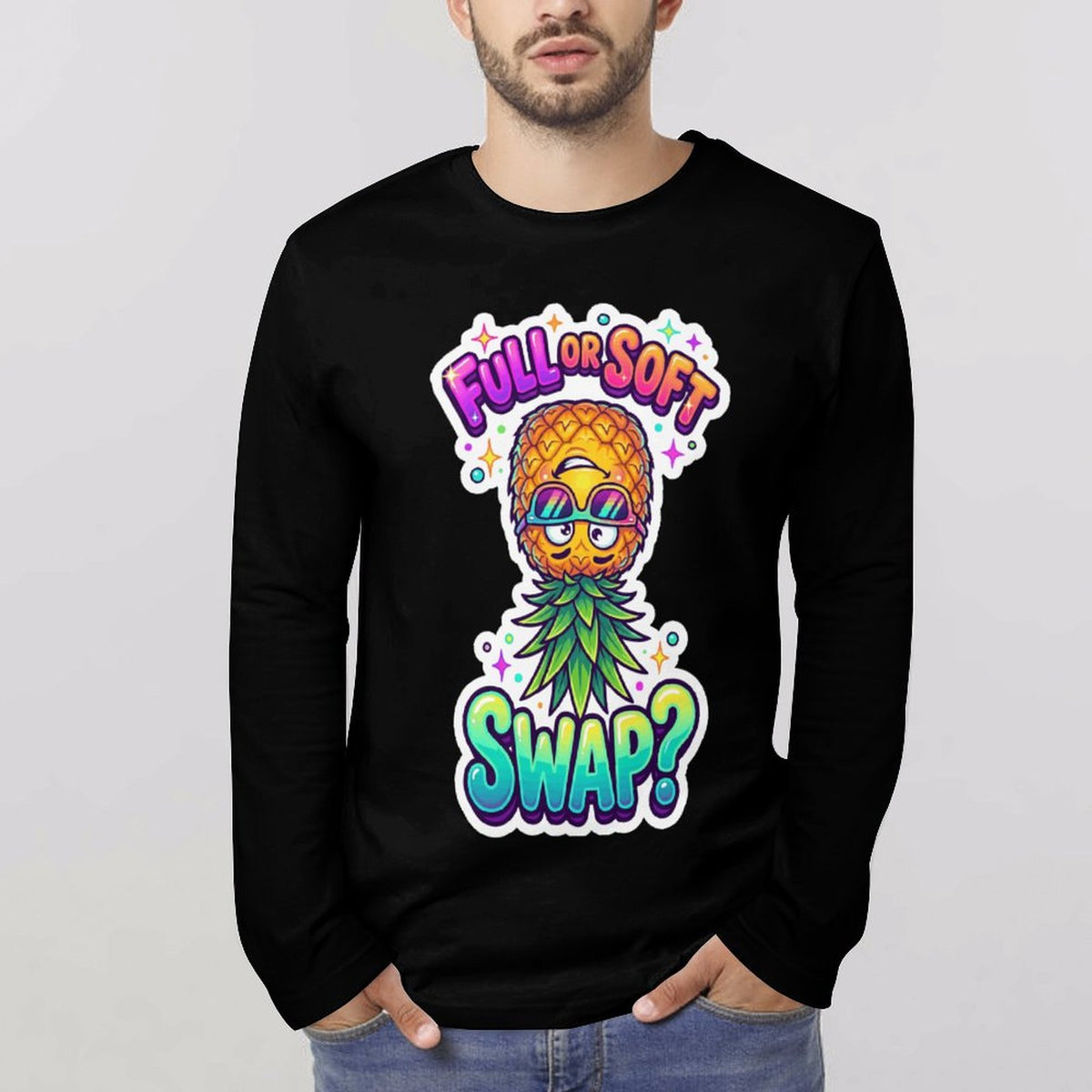 A man wearing a black long-sleeve crewneck sweatshirt with a colorful graphic of a pineapple wearing sunglasses and the text 'FULL OR SOFT SWAP?'.