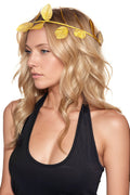 Woman wearing a gold leaf headband on a white background. Perfect for a swinger lifestyle toga party event.