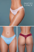 Three pairs of panties in white, blue, and red on a gray background.