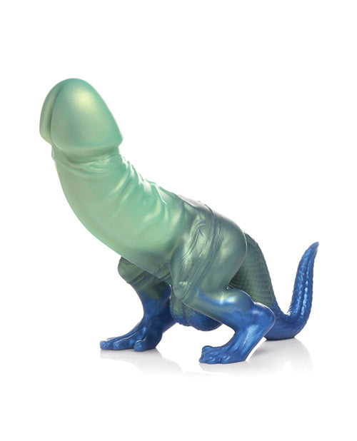 Toy dinosaur figure with green and blue coloration on a white background