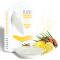 FUZU massage candle packaging with lemon, dates, and palm leaves on a white background