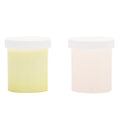 Two cylindrical containers with white lids on a white background