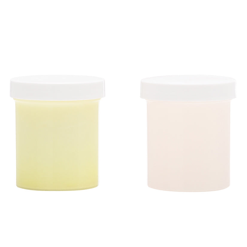 Two cylindrical containers with white lids on a white background