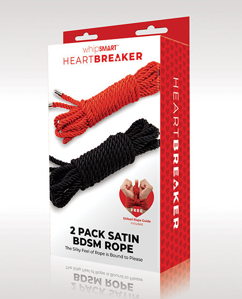 Packaged satin BDSM rope set with red and black ropes on a white background