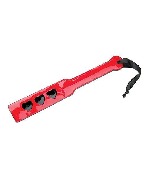 Red paddle with three heart-shaped holes on a white background