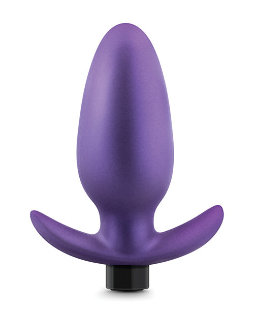Purple silicone butt plug on a white background
