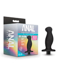 Black silicone product next to its packaging labeled 'Anal Adventures' on a white background