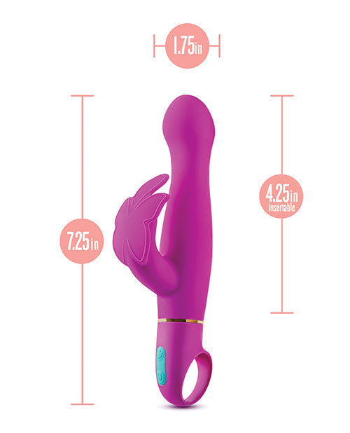 Purple and pink toy with measurements on a white background