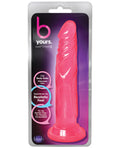 Pink toy in packaging with 'b yours' branding on a white background