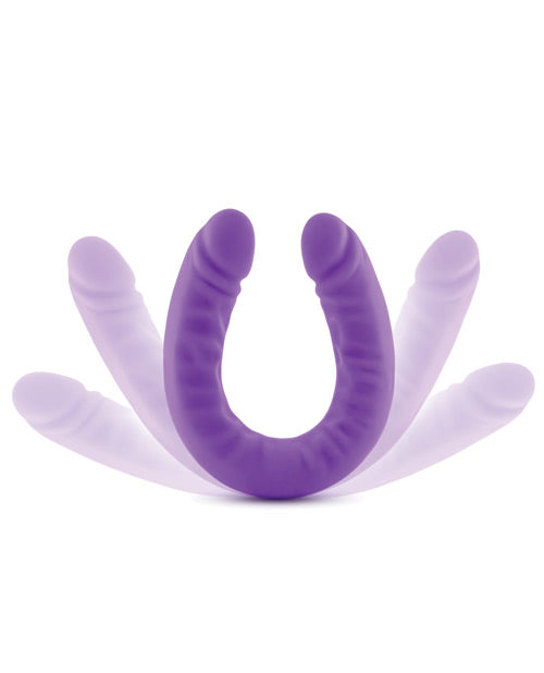 Purple silicone tool with multiple prongs on a white background