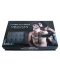 NeonWand Obsidian Intensity Kit packaging with a man and woman on a white background