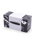 Marble-patterned box with a black and white product inside on a white background