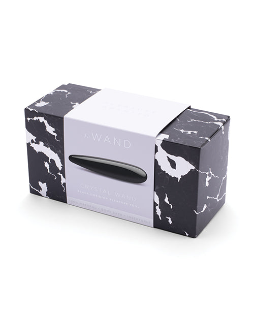 Marble-patterned box with a black and white product inside on a white background