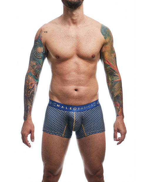 Man wearing blue patterned underwear with visible tattoos on arms, on a white background