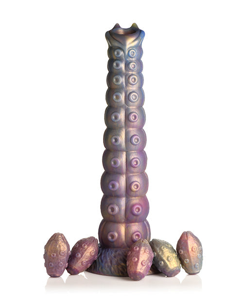 Iridescent candle holder with multiple small candles on a white background