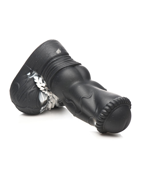 Black rubber boot with decorative elements on a white background