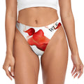 Woman wearing Wicked Lifestyles Red Floral inspired thongs. The thongs are white with red alcohol infused pattern across the front and back of the thongs. 