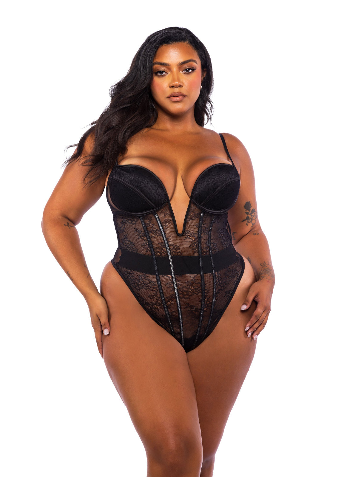 Model wearing a black lace lingerie set on a white background