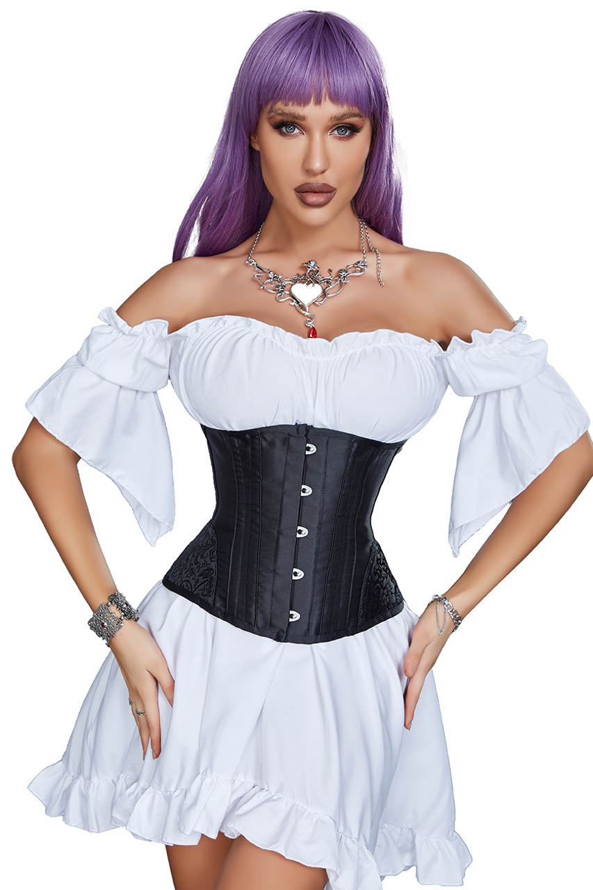Woman wearing a white off-shoulder top and black corset with a white skirt on a white background