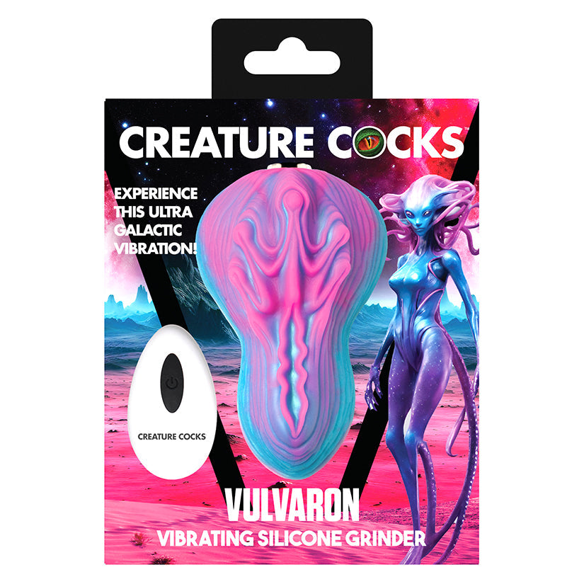 Vibrating silicone grinder packaging with alien design and 'Creature Cocks' branding.