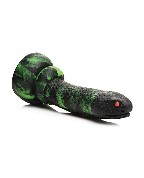 Black and green snake-shaped toy on a white background