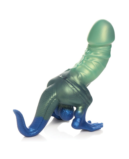 Toy resembling a green alien with blue feet on a white background