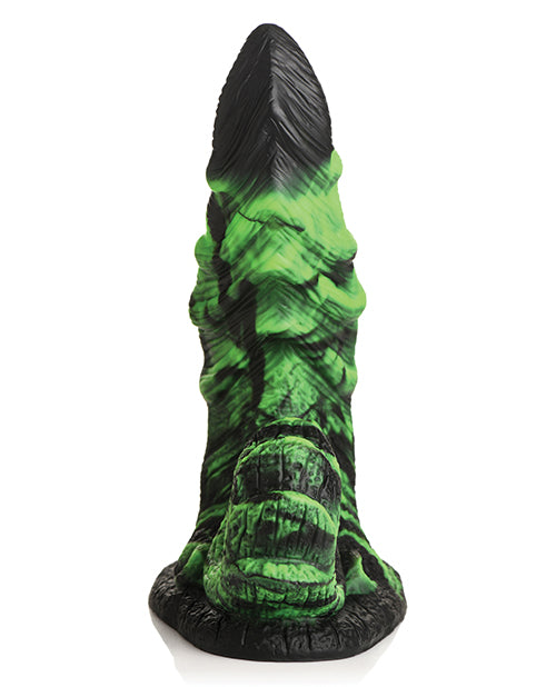 Green and black textured object on a white background
