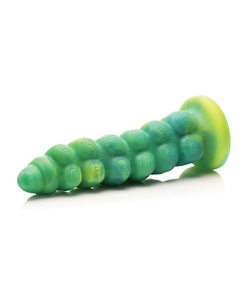 Green and yellow toy shaped like a caterpillar on a white background