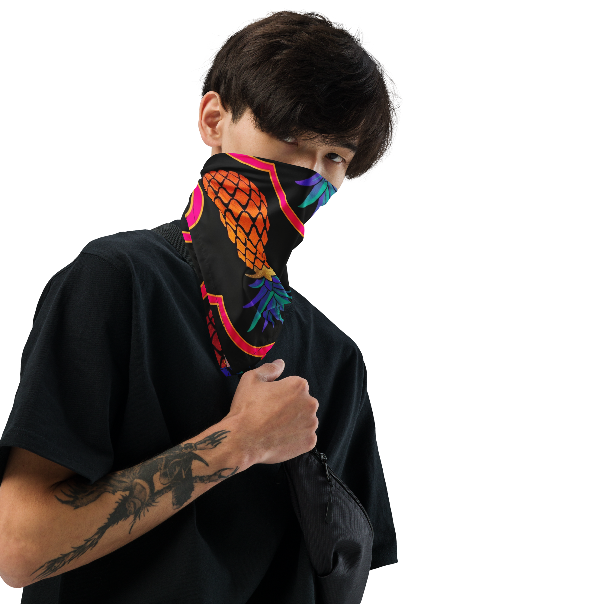Man wearing colorful upside down pineapple bandana over his nose & mouth