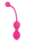 Pink toy with a curved handle on a white background