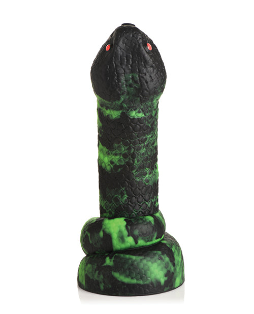 Black and green textured object on a white background